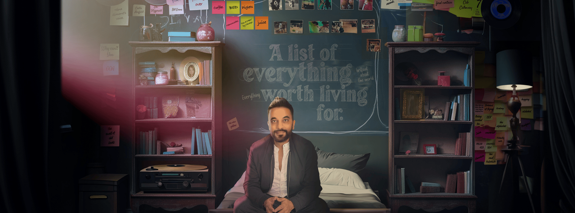 Image of a man seated at the end of a bed with his hands resting in his lap. He has warm-toned skin, a beard, and black hair. Behind him stretches a wall adorned with sticky notes and photographs. In the heart of this collage, text reads: "a list of everything worth living for." Flanking the bed, two tall bookshelves brim with books, framing the scene. Coloured papers scatter the floor.